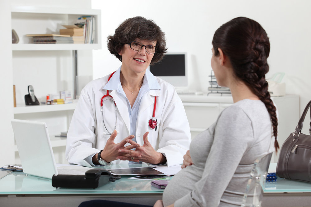 Pregnant woman in doctors appointment